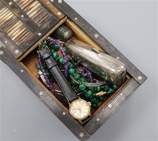 A small quantity of jewellery including a ladys Omega watch, silver cheroot holder case, thimble, amethyst bead necklace etc,